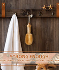 8 Piece Hella Durable Premium Leather Wall Hooks With Solid Brass Screws For Heavy Duty Curtain Hanging And Super Slick Bathroom Storage Essentials, displaying white towel and bath brush on wooden wall.