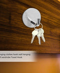 6 Pcs Stainless Steel Wall Hooks Zero Damage Install No Sweat Mount Heavy Duty Coat And Hat Hangers Punch Free Bath Towel Hooks Kitchen Racks hanging keys on a stainless steel wall hook mounted on wood.