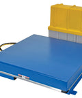 Rock Solid Welded Steel Electric Hydraulic Lift Table Featuring 48 By 48 Inch Platform And 12000 Pound Capacity For Shop Floors, blue scissor lift with yellow container.