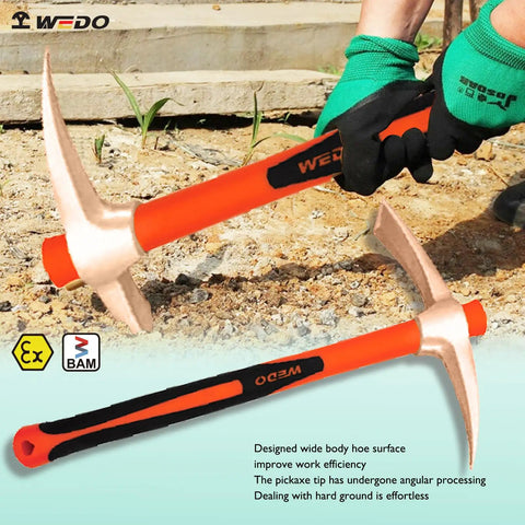 Worker using Non Sparking Round Point Shovel And Pick Mattock Set With 39 Inch Shovel And 36 Inch Pick Hoe for digging in dirt