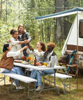 Group enjoying outdoors around a Six Foot Picnic Table Set With Two Benches, Three Piece Folding Outdoor Table And Chair Set