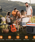 32 Quart Electric Car Cooler Warmer With Smooth Rolling Wheels Keeps Food And Drinks Ice Cold at a camping gathering with friends.