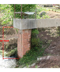 Concrete bridge with red brick pillar over stream, illustrating water head for 1.5 To 3KW Axial Flow Hydro Generator With Rare Earth Permanent Magnet.
