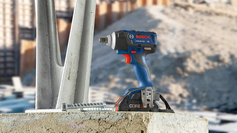 18V EC Brushless Half Inch Impact Wrench With Friction Ring And Through Hole Bare Tool Delivers Beast Power Up To 221 Ft-Lbs Torque For Lug Nuts, Lag Bolts And Concrete Anchors on concrete block