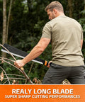 Person using Beast Mode Heavy Duty Sickle Machete For Yard Work And Bush Clearing 20 Inch Black Stainless Blade in forest