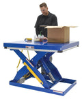Straight Up Heavy Duty Electric Hydraulic Lift Table With 40 By 48 Inch Platform in use with worker and cardboard box.