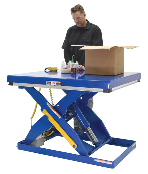 Straight Up Heavy Duty Electric Hydraulic Lift Table With 40 By 48 Inch Platform in use with worker and cardboard box.