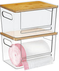 Kicking Clutter Away Trash Bag Dispenser 2 Pack clear acrylic bins with bamboo tops holding plastic grocery bags, 11.2x7.5x7 inches.