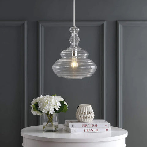 Chrome Modern LED Pendant Light for Kitchen Island and Hallways, clear glass shade, hanging above white table with decor.