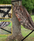 Camo Tree Hammock Chair Portable Hunting Stool attached to tree, showing straps and chair fabric pattern, supports 330 lbs.