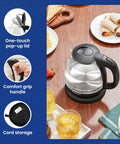 Fast Boil 1 Liter Glass Electric Kettle Cordless 360 Degree Base BPA Free 1100W With Auto Shutoff on kitchen table
