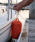 Solid Nylon Boat Fenders For Docking And Marine Anti Collision Protection in use on docked vessel, orange color