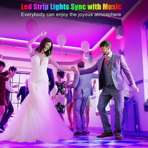 Couple dancing under 50Ft Bluetooth RGB LED Strip Lights For Bedroom With App Control And Remote Music Sync Dimmable Color Changing LED Tape For Room Kitchen Party Dope Vibe Home Decor Power Adapter Included.