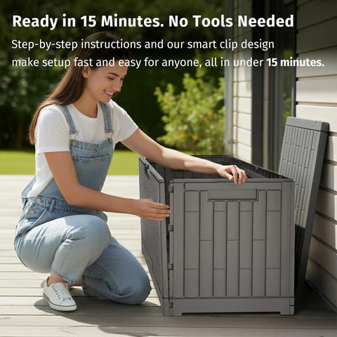 Person assembling 120 Gallon Outdoor Storage Box For Patio And Backyard Heavy Duty Resin Deck Box Built To Last With Reinforced Stainless Steel Support Waterproof And UV Resistant Weatherproof Storage For Cushions Garden Tools And Pool Accessories Grey on patio.