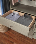 Rock Solid Dual Tower Closet Organizer Kit With Weathered Grey Finish and Slick Wall Mounted Steel Rail System Featuring Game Changing Drawers for Effortless Home Organization and No Fuss Assembly with neatly folded shirts.