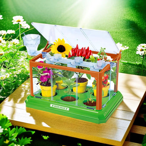 Awesome Kids Gardening Kit With Greenhouse And Terrarium showing flowers and plants in liftable roof greenhouse on wooden table.