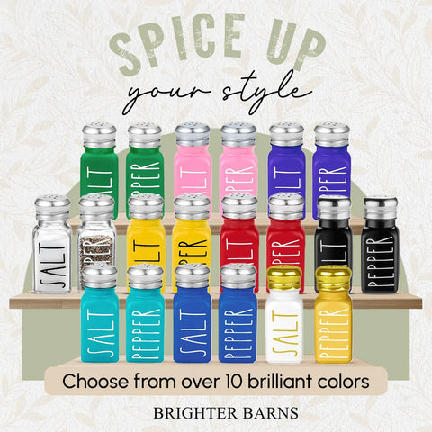 Colorful variety of Clear Glass Salt And Pepper Shaker Set With Stainless Steel Lids For Modern Farmhouse Kitchen Decor on wooden shelf.
