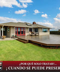 Heavy Hitter Oil Based Wood Preservative And Exterior Stain In Warm Pecan Hue displayed on well-protected wooden deck and home.