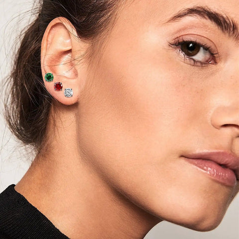 Real Good Titanium Flat Back Screw Back Stud Earrings In Crisp White 6Mm Post on model's ear, showcasing sleek design and fit.