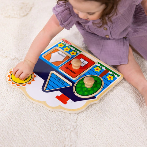 Child playing with First Shapes Jumbo Knob Puzzle For Toddlers With Wooden Peg Pieces, Kid Friendly Shape Matching Toy