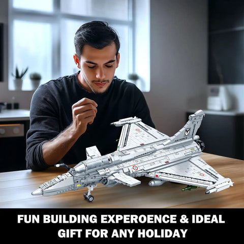 Man assembling Rafale Inspired Fighter Jet Building Set For Adults And Teens 14 And Up, 2099-Piece military aircraft model