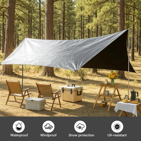 Heavy Duty Waterproof Tarp 10 By 10 Feet 16 Mil used as shelter in a forest camping setup, showing silver and black sides.