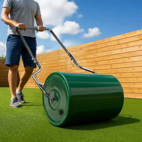 Man using Heavy Duty 16 Inch Steel Lawn Roller With U Shaped Handle Water Or Sand Filled Garden Roller on green lawn