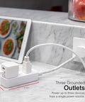 Three Outlet Power Strip With Braided Six Inch Extension Cord Grounded Flat Plug ETL Listed White on kitchen counter