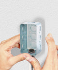 Hands installing Tough As Nails 3/4 Inch Rigid Conduit Lock Nut in a metal junction box for IMC tube mounting.
