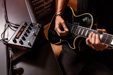 Musician using TONEX Pedal Ultra Realistic Stereo Multi-Effects For Guitar And Bass With 150 Gig-Ready AI-Powered Presets