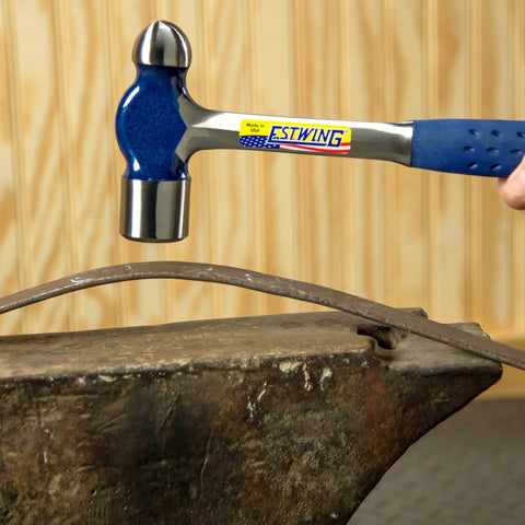 32 Oz Ball Peen Hammer For Metalworking, Forged Steel Construction, Shock Reduction Grip in use on anvil in workshop