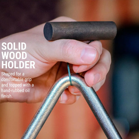 Triangle Percussion Instrument Handcrafted In USA By Nashville Small Biz, Premium Alloy Triangle For Rich, Warm Chime Tone, Supports American Jobs, Made In Tennessee Music Gear. Hand holding metal triangle with solid wood holder.