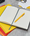 Nothing Moves Without Us Hardcover Journal For Logistics Pros Desk Essential With 240 Lined Pages And 120 Sheets Elastic Closure Ribbon Bookmark Expandable Inner Pocket And Pen Holder Black, open with pen