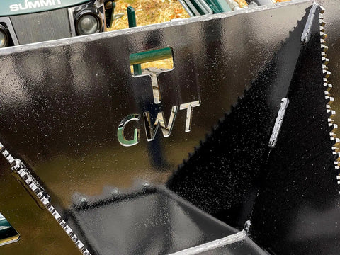 Close-up of Beefy Mini Wrecker Stump Bucket for Small Tractors with logo and serrated edges