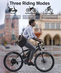 Man riding Beast Electric Bike For Adults 27.5 Inch 500W Ebike through city, showcasing three riding modes.