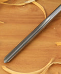 Kickass Three Piece HSS Bowl Gouge Set Featuring Solid Beech Handles For Flawless Bowl And Vessel Turnings heavy duty gouge close-up on wooden shavings.