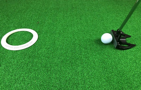 All Direction Putting Cup Ring Indoor Golf Practice Hole Trainer with white ring and putter on green turf