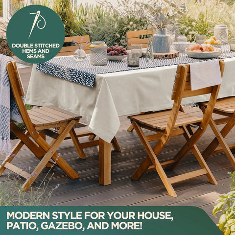 Outdoor dining setup with wooden chairs and a table featuring a beige drop cloth, highlighting double-stitched hems and seams.