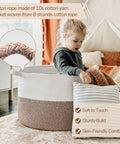 Child sitting in XXL Cotton Rope Blanket Basket With Handles For Living Room Storage 21.7 Inches Square And 13.8 Inches Tall Handwoven