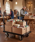 Heavy Duty 2000 Lb Steel Platform Cart With 47 By 24 Inch Anti Slip Platform, Detachable Handle For Easy Storage, 360 Degree Swivel Casters, A Real Warehouse Workhorse For Pros. Loaded with food boxes in a church hall