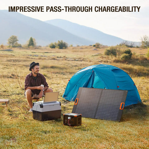 Off Grid Ready 519Wh Portable Power Station with 2 110V AC Outlets beside tent, powering laptop during camping trip