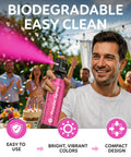 Sick Vibes Pink Smoke Bomb Powder Spray Launcher Kit For Outdoor Raves And Festivals Featuring Hella Biodegradable Color Burst And Super Quick Cleanup, man using spray at an outdoor party.