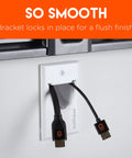 In Wall Cable Hider Kit 2 Pack Single Gang Pass Through With Drywall Brackets Conceals Up To 8 Low Voltage Cables Fast Easy Install With Cutting Template DIY Cable Management with HDMI cables visible through wall plate for a clean finish.