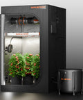 Auto Drip Irrigation System Kit With 13 Gallon Bucket, 25W Water Pump inside grow tent, visible plants and lighting setup