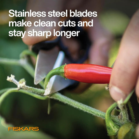 Close-up of Herb Garden Snips With Sheath And Soft Grip Handle For Easy Kitchen Harvests Five Inch Stainless Steel Garden Scissors cutting a plant stem.