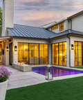 Weatherproof Outdoor Wall Light Fixtures 2 Pack Modern Matte Black Sconces on exterior wall by pool at dusk
