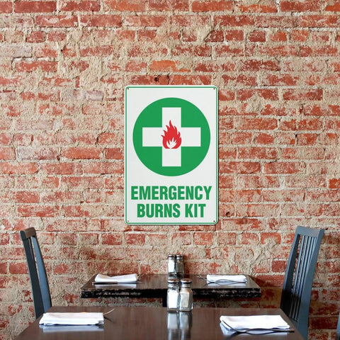 Rustproof Aluminum Warning Sign For First Aid Burn Kit Location 8 By 12 Inches With Clear Bold Lettering on brick wall