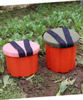 Portable Gardening Wearable Stool Grab And Go Lightweight Foam Work Seat in garden setting, pink and green seats with straps.