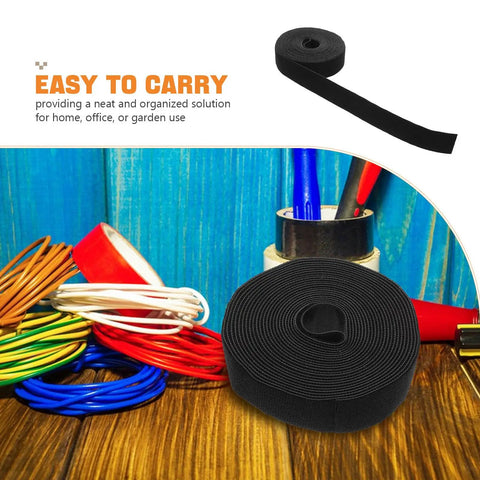 Total Setup Upgrade Reusable Self Adhesive Cable Tie Roll For Hassle Free Desk Cord Management In Black with cables on a wooden surface.