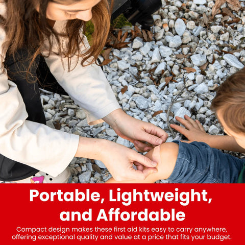 First aid bandage being applied to a child’s elbow outdoors on rocky gravel.